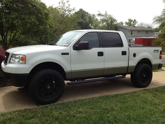 White ford truck with black wheels #2