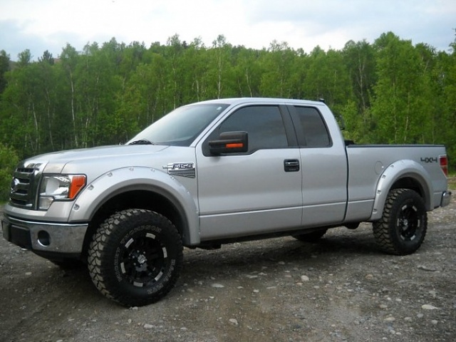 Silver ford f150 with black rims
