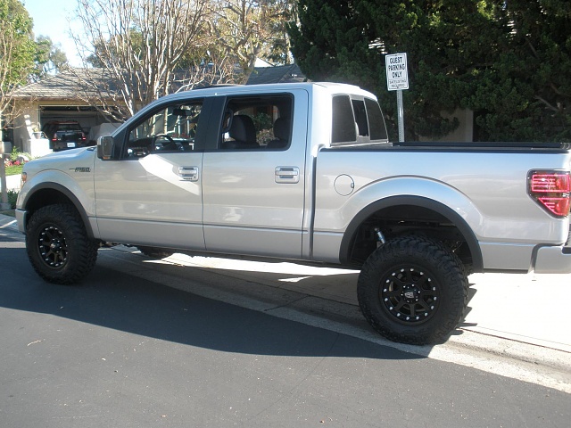 Silver ford f150 with black rims #10