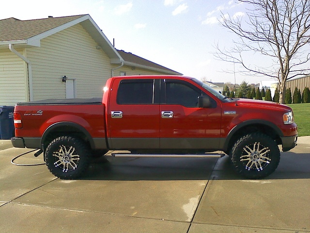 Red ford f150 with black rims #1
